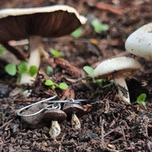Load image into Gallery viewer, Button Mushroom Drop Earrings in my Garden surrounded by Real Mushrooms