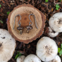 Load image into Gallery viewer, Button Mushroom Drop Earrings on a Wooden Stump Surrounded by Real Mushrooms in my Garden