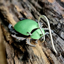 Load image into Gallery viewer, Christmas Beetle Green Drop Earrings Close Up Front On Sitting on a Wood Block