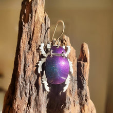 Load image into Gallery viewer, Christmas Beetle with purple shell on a wooden block