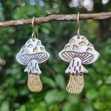Load image into Gallery viewer, Fly Agaric Toadstool Mushroom Drop Earrings hanging on a branch front on view
