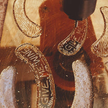 Load image into Gallery viewer, Behind the scenes look of us making GIVE ME WINE ear cuff with the CNC Machine