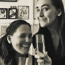 Load image into Gallery viewer, Sheridan and Jemica cheering with a glass of champagne to the launch of our collaboration