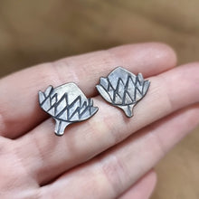 Load image into Gallery viewer, Protea Head Studs Modelled between Jemica's finger tips for size comparison