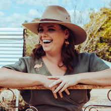 Load image into Gallery viewer, Copper Emu Brooch modelled by Erin and she is laughing and resting her arms on the fence
