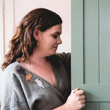 Load image into Gallery viewer, Copper Scrub Turkey with Patina modelled by Erin side view