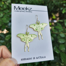 Load image into Gallery viewer, Luna moth drop earrings on a card