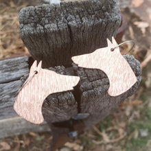 Load image into Gallery viewer, Doberman Head Drop Earrings sitting on a fence post