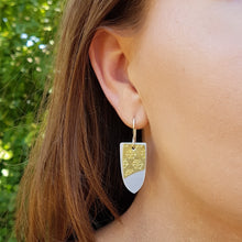 Load image into Gallery viewer, Double Drop Earrings Shield Brass Multi Lrg Snowflakes Aluminium Modelled by Michaela
