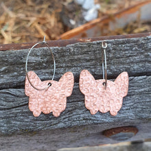 Load image into Gallery viewer, French Bulldog Head Copper Hoop Earrings sitting on a fence