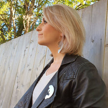 Load image into Gallery viewer, Manatee Brooch Modelled with Giant Hoop earrings