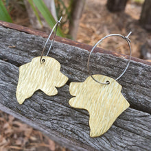 Load image into Gallery viewer, Labrador Head Brass Hoop Earrings sitting on a fence