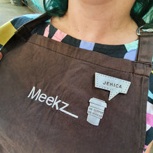 Load image into Gallery viewer, Large No Coffee No Workee Brooch / Pin on Packaging card modelled for size on my apron