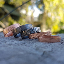 Load image into Gallery viewer, Copper Tube Rings laying down stacked on a wood block