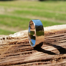 Load image into Gallery viewer, 5mm sterling silver ring beaten texture high polish modelled on a log