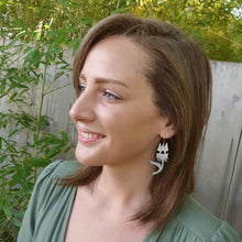 Load image into Gallery viewer, australian native flower - sturt desert pea earrings side view on model