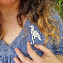 Load image into Gallery viewer, Bush Stone-Curlew Brooch Modelled by Jemica on her Dress 
