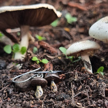 Load image into Gallery viewer, Button Mushroom Drop Earrings in my Garden surrounded by Real Mushrooms
