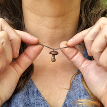 Load image into Gallery viewer, Button Mushroom Necklace Modelled by Jemica in her hands
