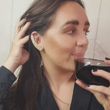 Load image into Gallery viewer, GIVE ME WINE ear cuff modelled by Sheridan Eveline drinking wine
