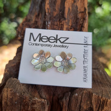 Load image into Gallery viewer, Paper Daisy Studs on packaging card sitting on a stump
