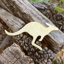 Load image into Gallery viewer, Brass Kangaroo Brooch sitting on a wooden fence
