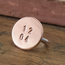 Load image into Gallery viewer, A copper and sterling silver cocktail ring with the numbers 12 04 stamped on the top.
