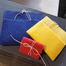 Load image into Gallery viewer, Handmade recycled felt jewellery pouches I made for gift wrapping
