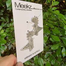 Load image into Gallery viewer, Dinosaur T-Rex Drop Earrings on Card Side View
