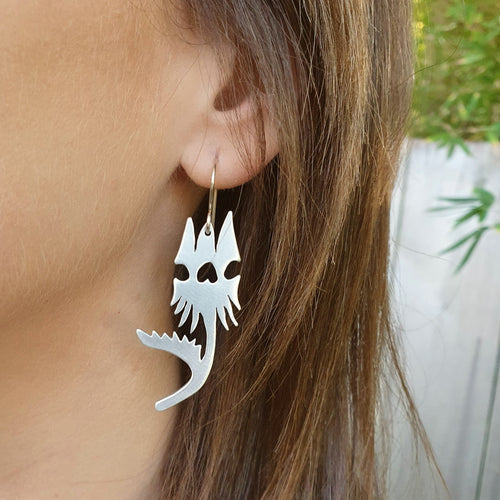 Australian native flower - sturt desert pea earrings modelled closeup